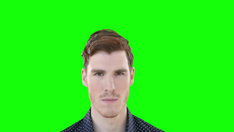 man smiling against green screen background