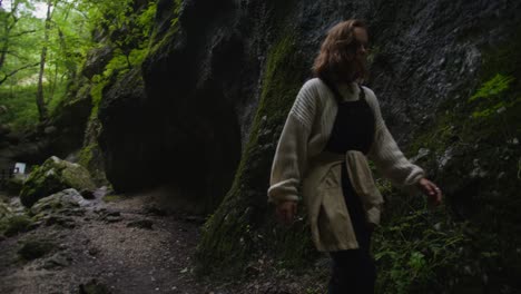 woman hiking through a canyon