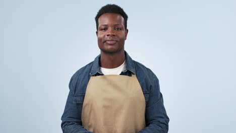 waiter man, thumbs up and smile in studio