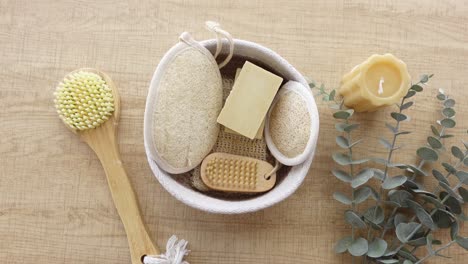 spa and wellness products with loofah, soap, and candle