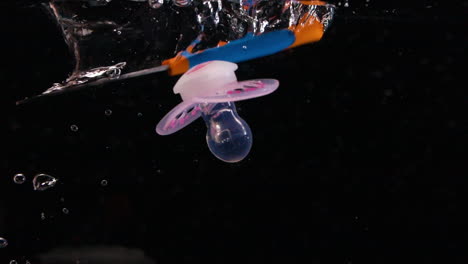 Slow-Motion-Baby-Objects-Drop-in-Water-with-Bubbles-Parenting