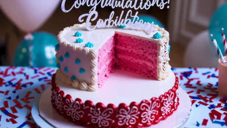pink layered cake with turquoise decorations