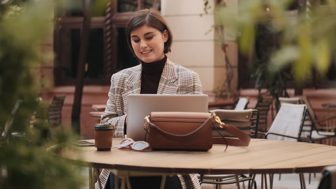 Young businesswoman working outdoor.