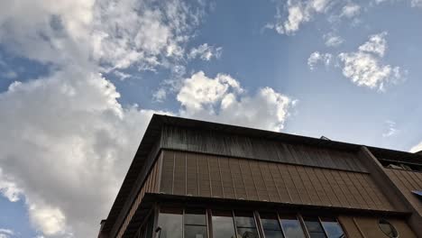 time-lapse of a building with vehicles passing by