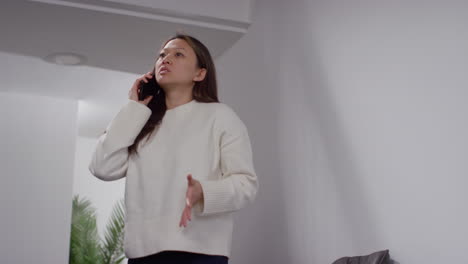 Angry-Anxious-Or-Stressed-Woman-Having-Argument-On-Mobile-Phone-At-Work-In-Office-Building-7