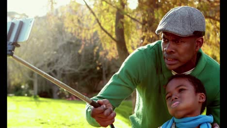 happy father and son in the country on autumns day