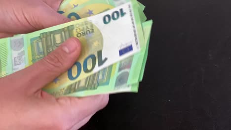 close up 100 € count several 1000 euro in hand