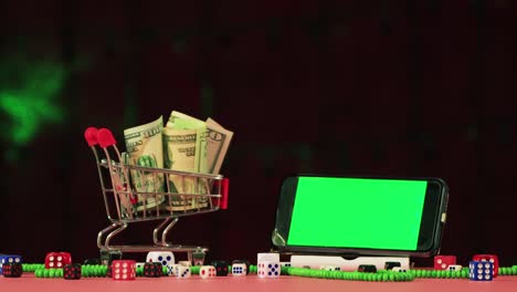 para navidad, dinero en una canasta y un teléfono con una pantalla verde para insertar.
