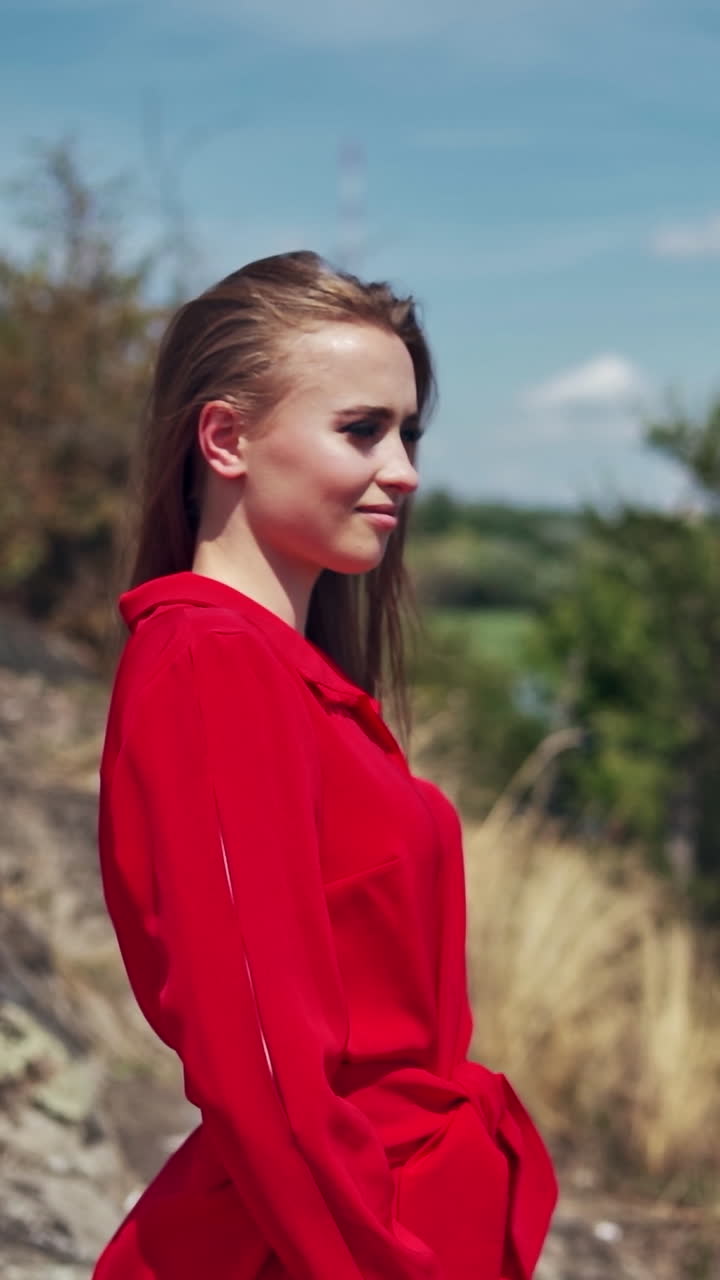 Young female on nature. Portrait view of female natural beauty. Vertical video