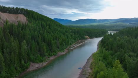 tourist rafting on flathead river in middle fork near glacier national park in montana, usa