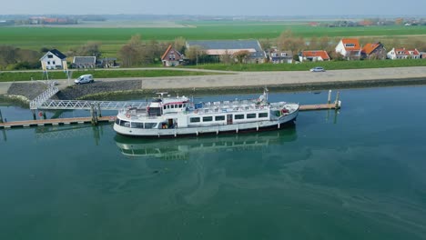 Close-up-shot-of-the-ship-at-the-harbour-with-oily-water