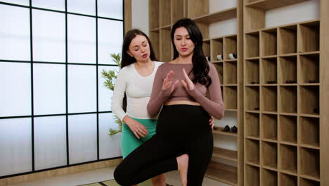 women doing yoga indoors