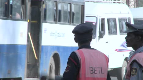 officers direct traffic on a busy street