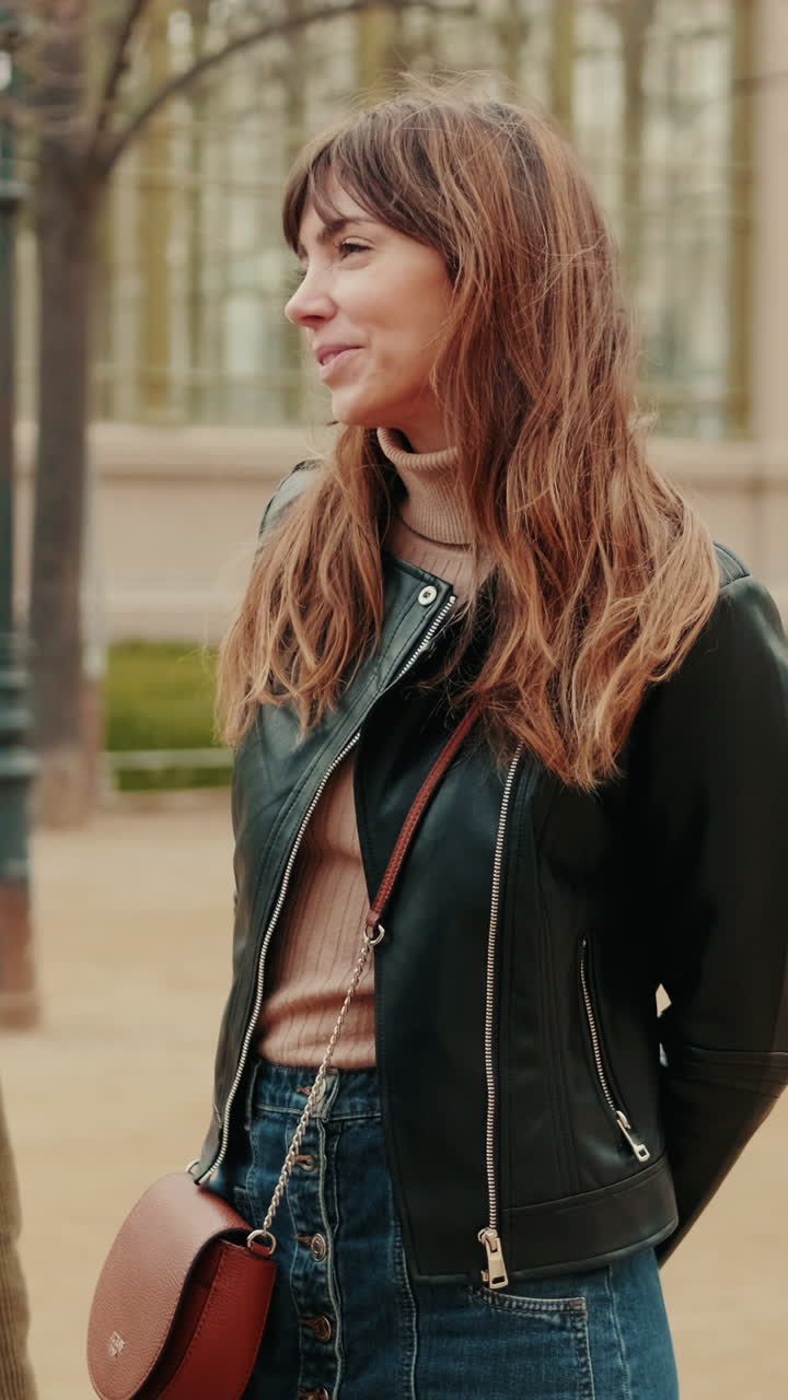 Happy Young Woman Laughing and Smiling in an Urban Park