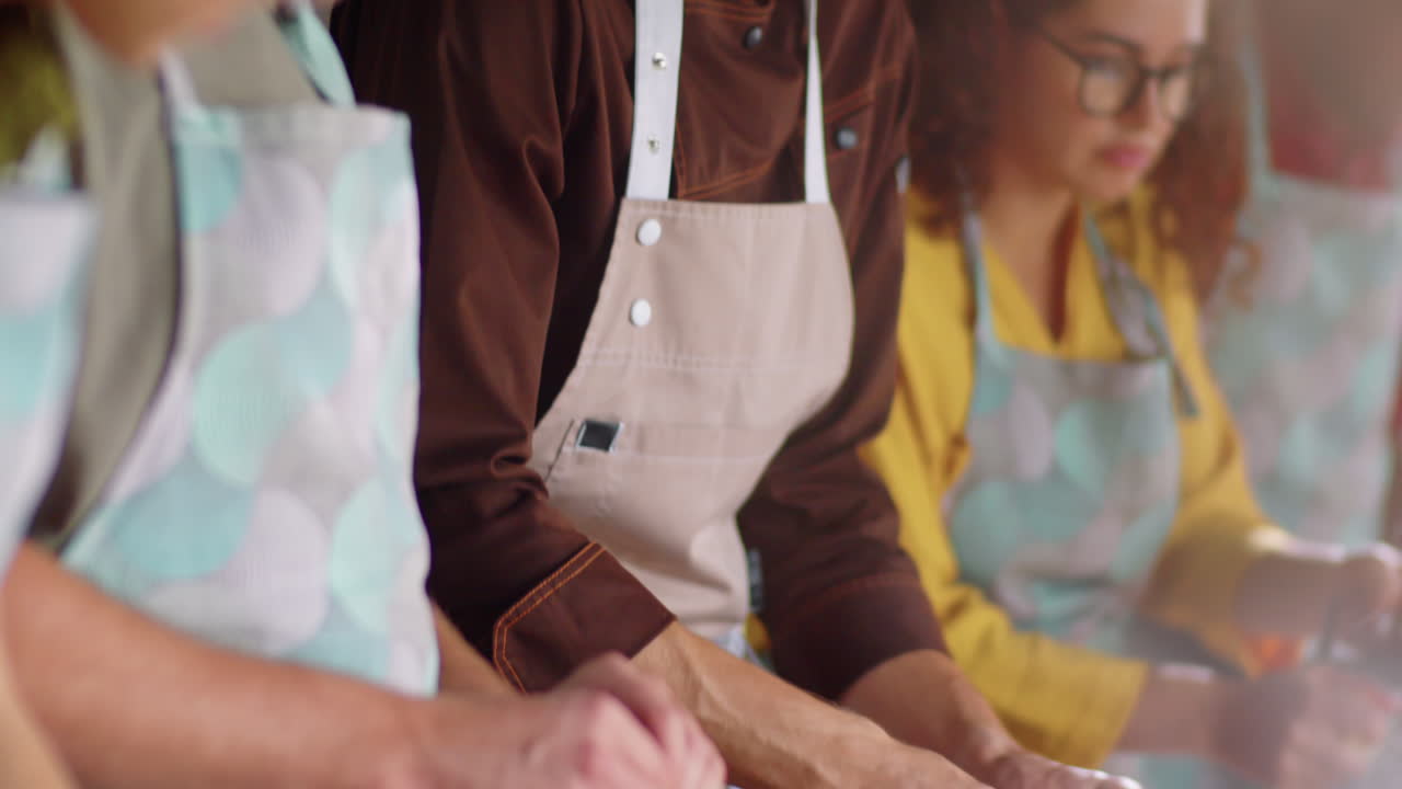 Chef and Students Smashing Garlic at Cooking Master Class