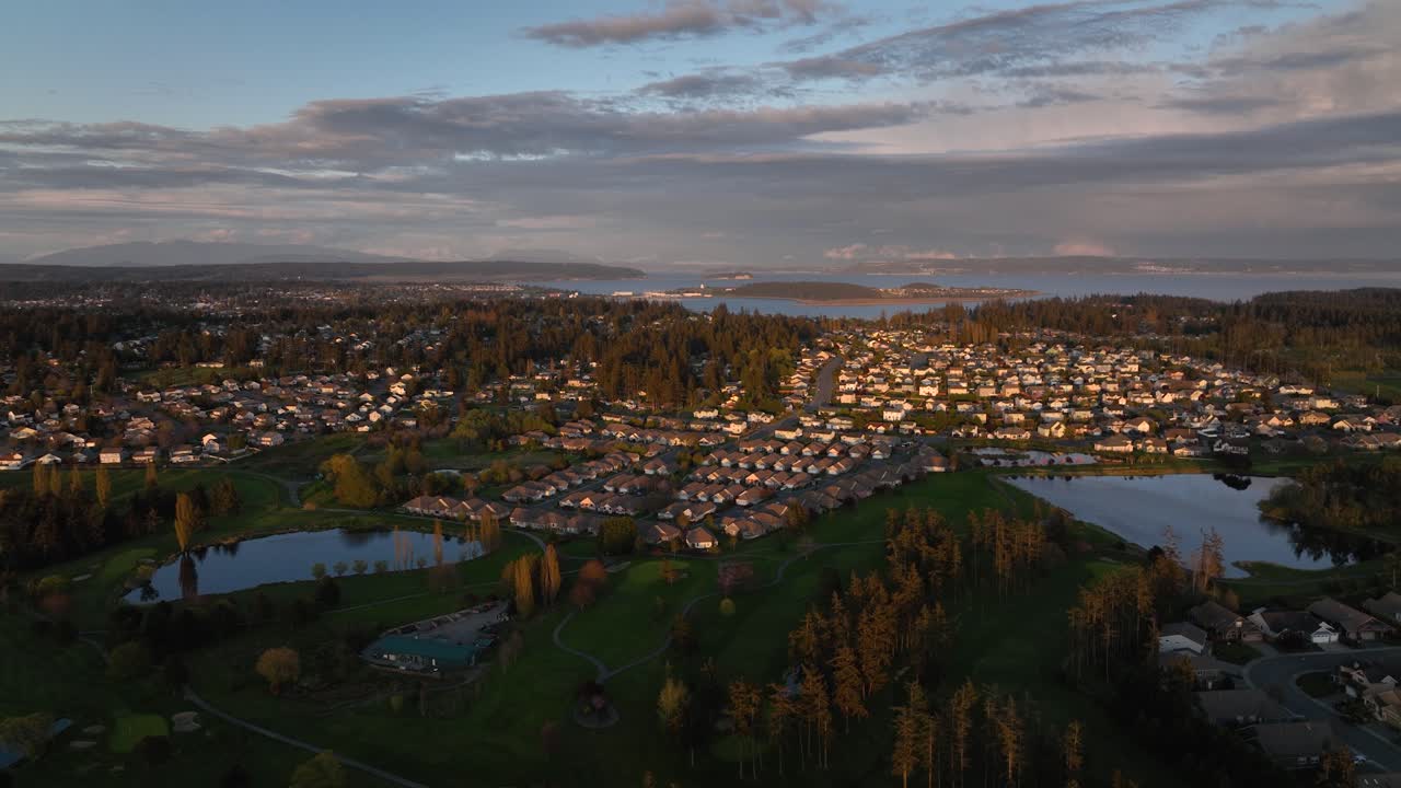 Wide establishing aerial shot of Oak Harbor's vast neighborhood communities which support housing for Whidbey Island's Naval Air Station.