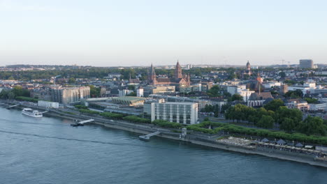 Aerial drone View of Mainz Rhine River, Castle, dom, Theodor Heuss Bridge and Cityscape at Sunset Germany 4k flight away