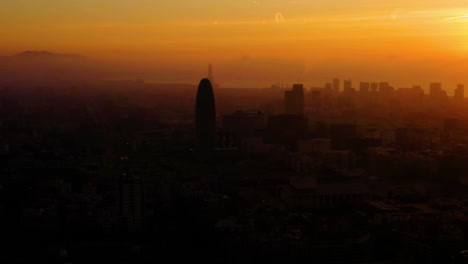 Sunrise-Aerial-view-in-Barcelona-over-Sant-Marti,-Poble-Nou,-Gran-Via,-Spain