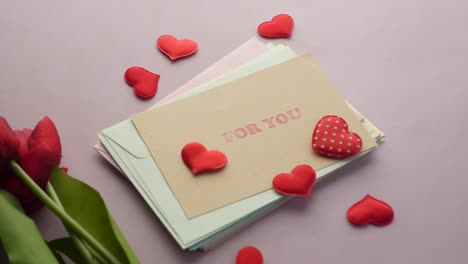 Heart-shape-symbol-and-envelope-on-red-background