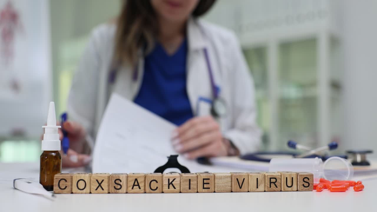 Text coxsackie virus on wooden cubes with nasal drops and pills