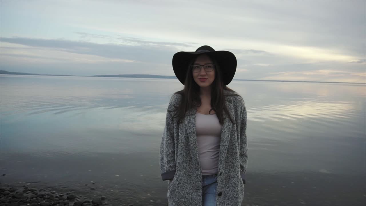 Woman at the lake at sunset