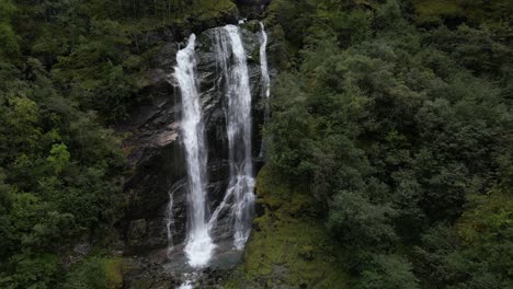 waterfall in the narrow fjord of norway