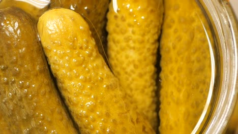 pickled cucumbers in a jar