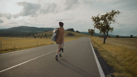 woman with backpack and binoculars enjoys running on road