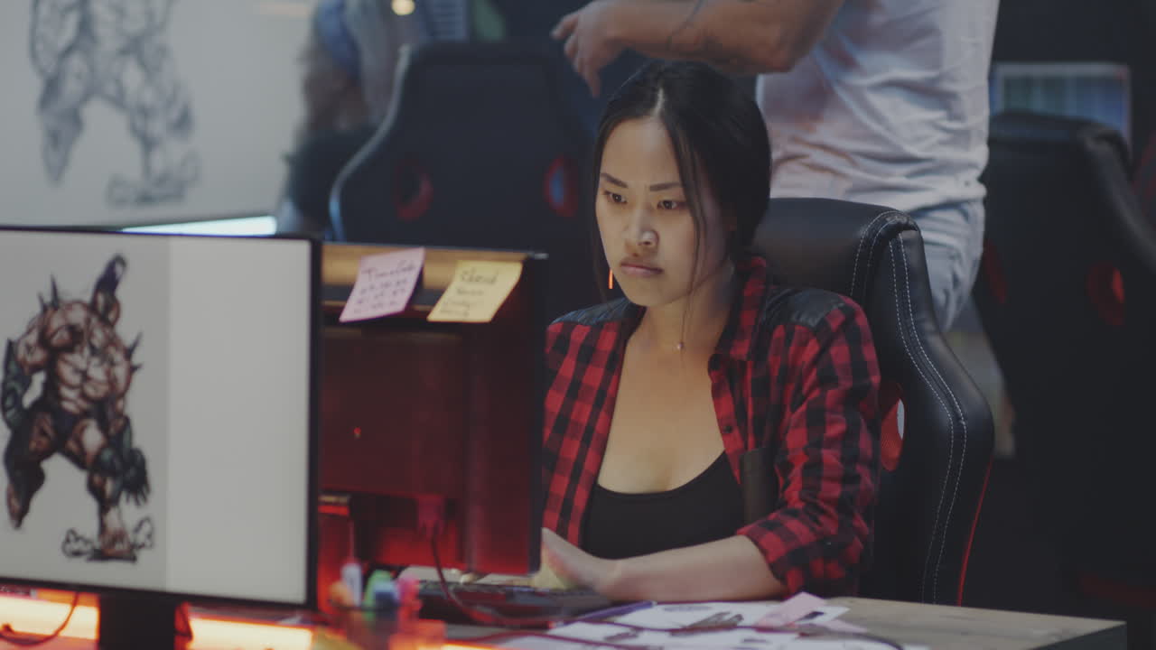 Woman Working on Graphic Design Project in a Design Studio