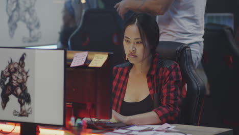 woman working on graphic design project in a design studio