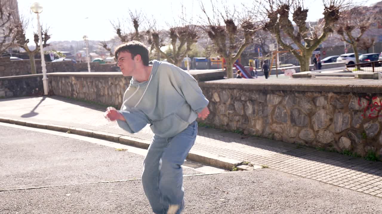 A person running down the street in an urban environment