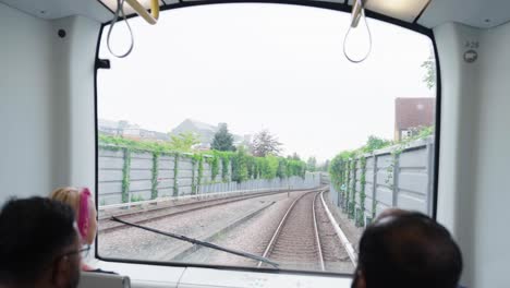 train ride through city suburbs