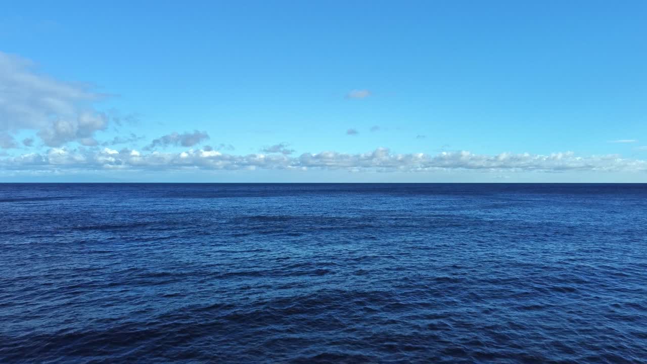 Soaring above East Maui’s pristine shoreline, this aerial view reveals the deep blue ocean waters, offering a serene and scenic glimpse of Hawaii's unspoiled nature.