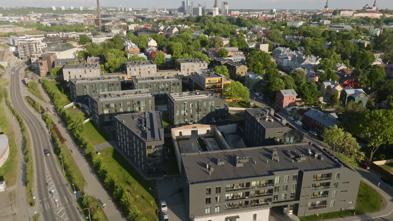 Aerial tracking shot of office buildings, sunny, summer day in Tallinn, Estonia