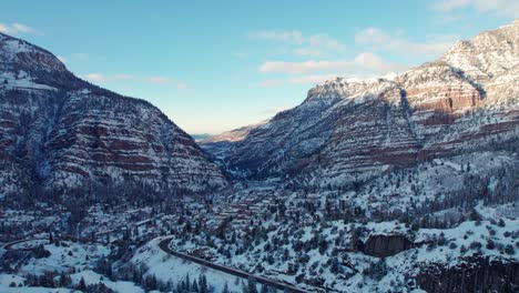 Drone-aerial-views-of-Ouray,-Colorado-with-the-highway-in-the-foreground