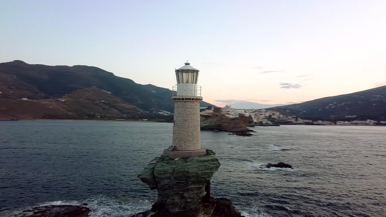 Orbit View of Chora of Andros Tourlitis Lighthouse at Sunset, Greece