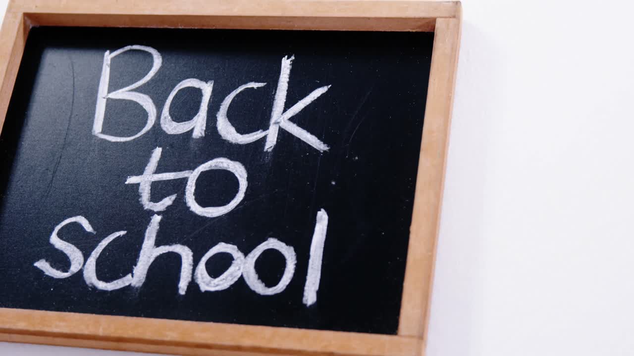 Text back to school written on a chalkboard