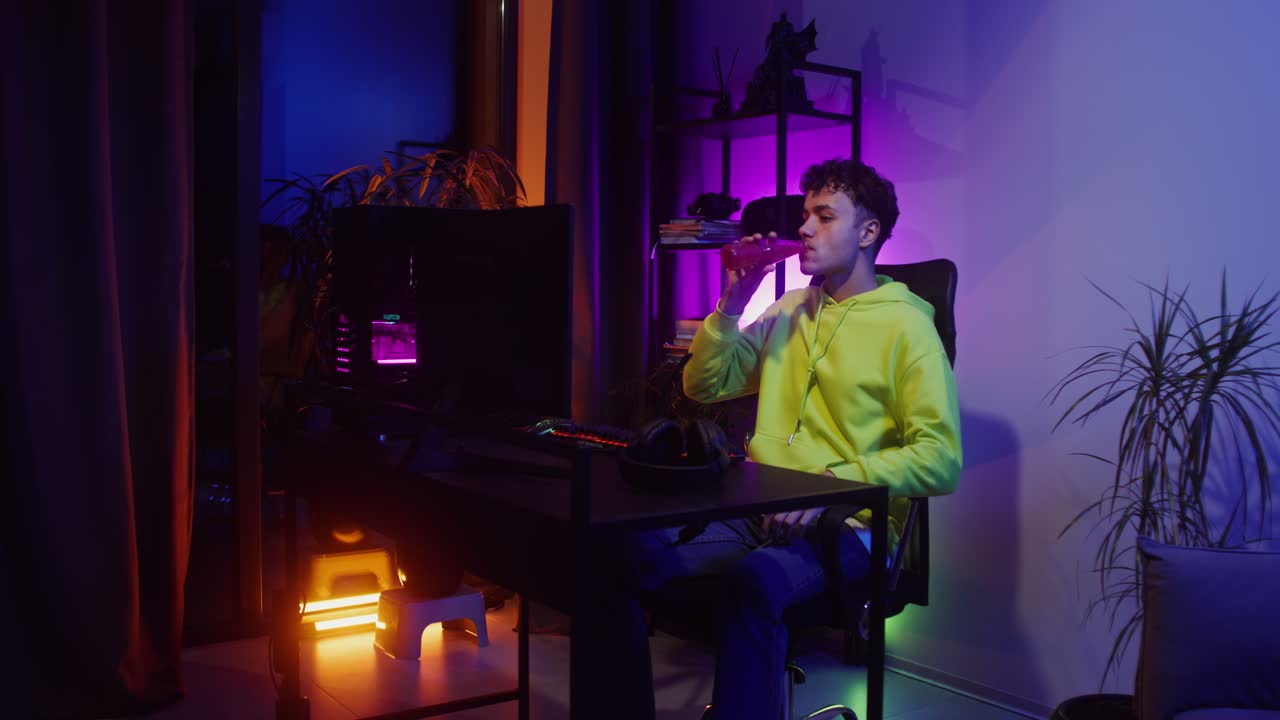 Man Gaming at Desk at Home