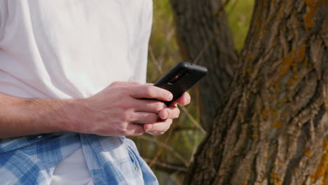 man using a smartphone outdoors