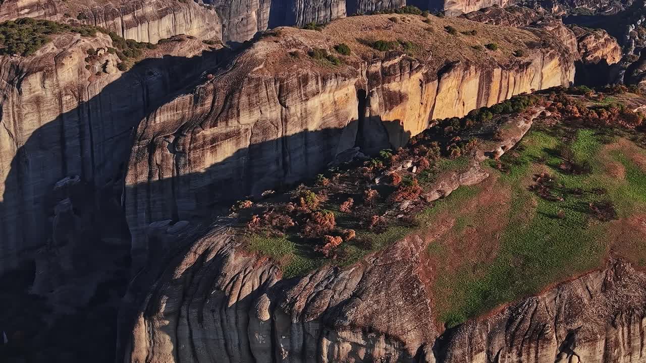 Explore unique rock formations in Meteora, Greece during the sunset