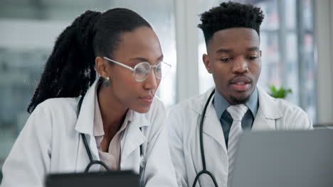 laptop, research and team of doctors in an office