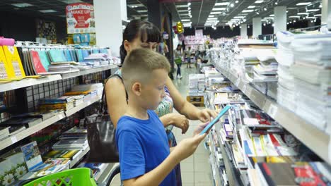 vinnitsa, ukraine - august 20, 2018: child choosing school stationery in store