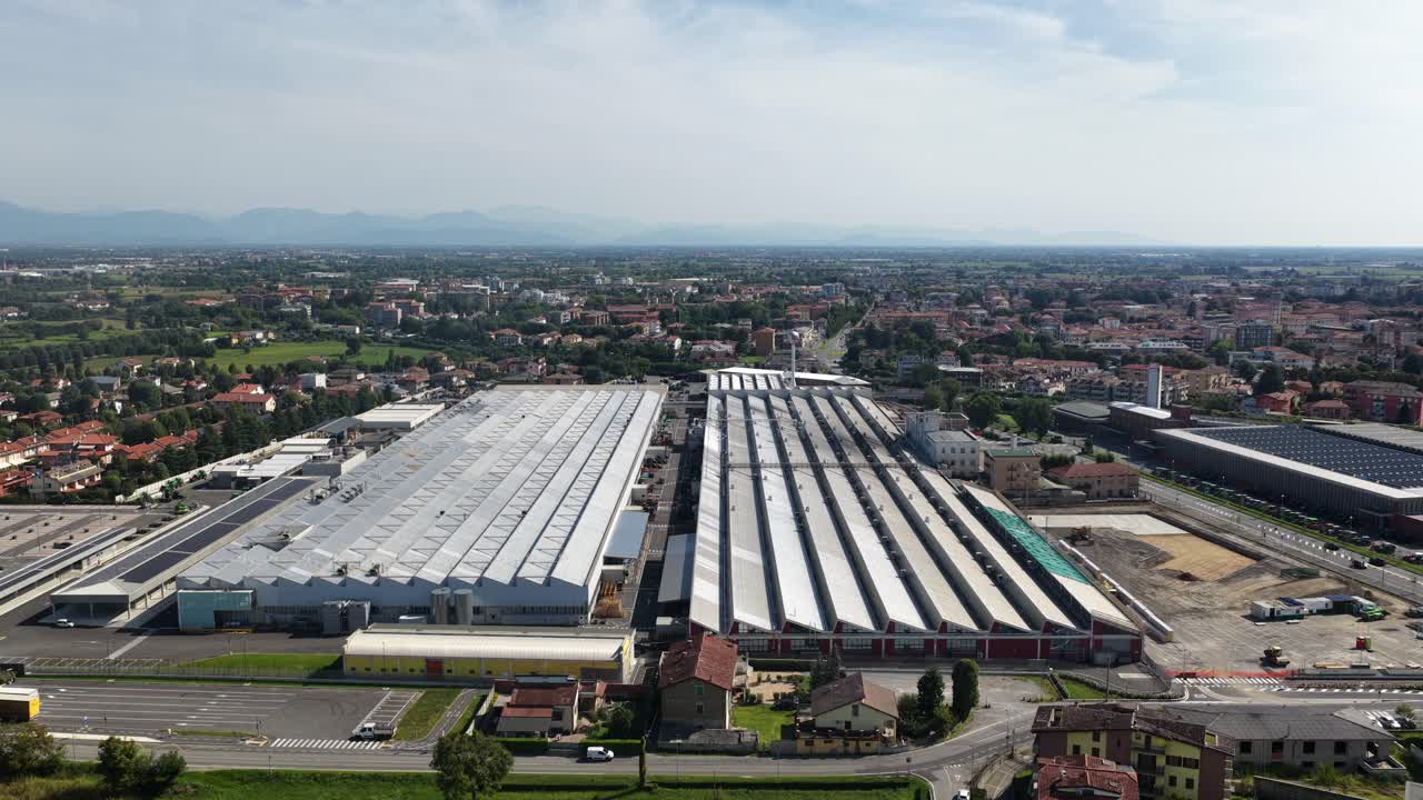 factory and assembly building in northern Italy, commercial manufacturing, industrial environment,aerial drone video