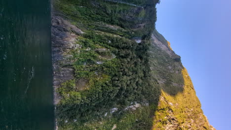 stirling falls in milford sound, vertical video pan left