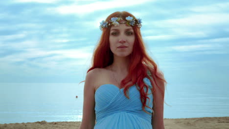 red hair woman portrait on sea coast. closeup of redhead woman