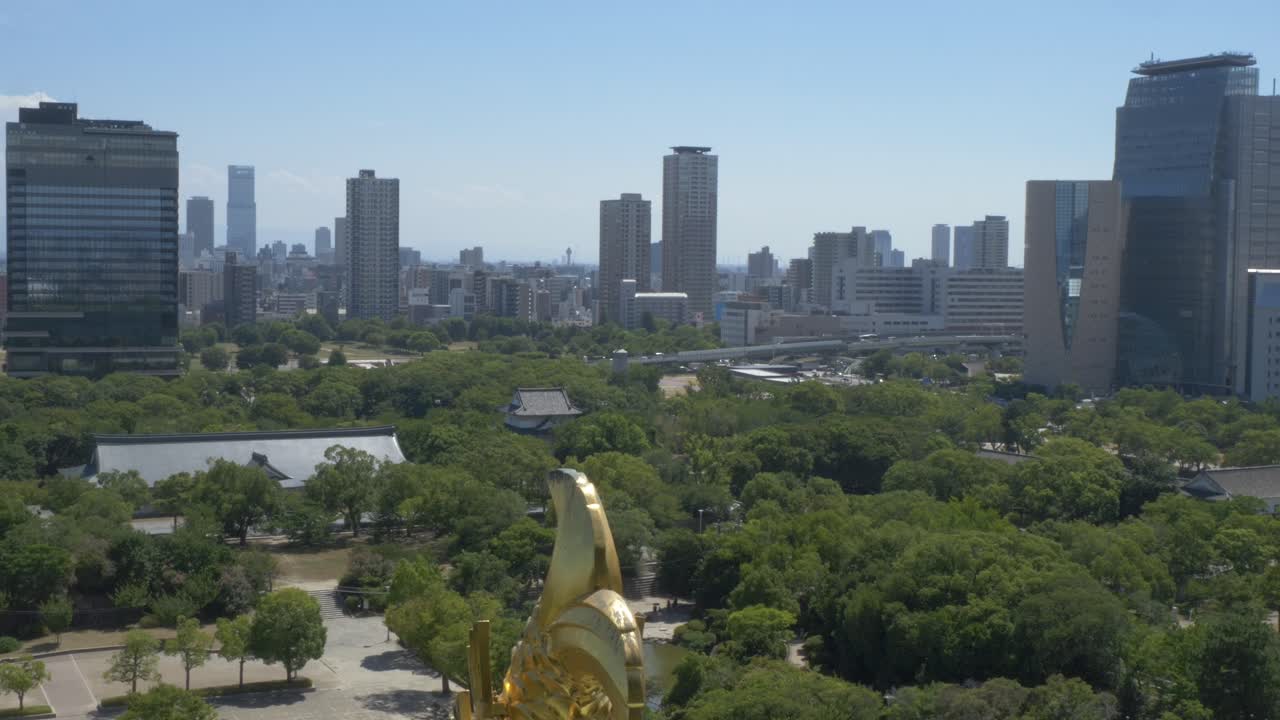 Modern And High-rise Buildings Seen From Osaka Castle Park In Japan. - wide shot
