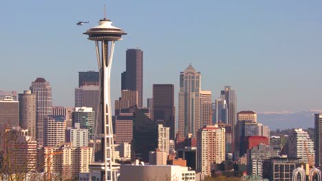 beautiful establishing shot of seattle washington on a sunny day with a helicopter flying by