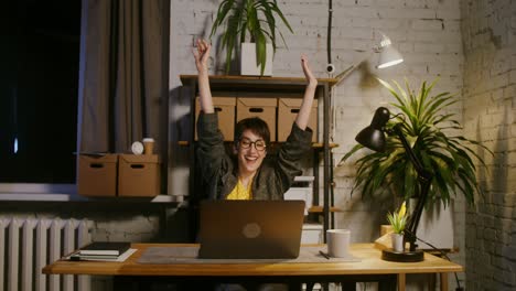 woman working late night in a home office