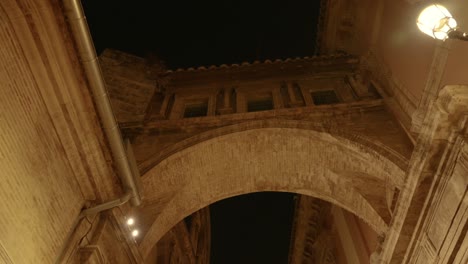 the passage d emili aparicio olmos that connects the cathedral of valencia and the basilica at night, spain