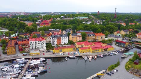 colorful apartments near a commercial harbor in stockholm, sweden